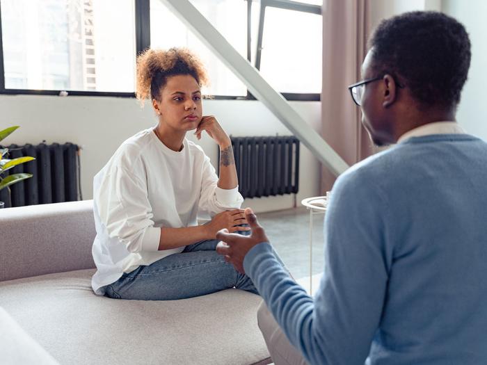 A woman listens with care during a supportive conversation